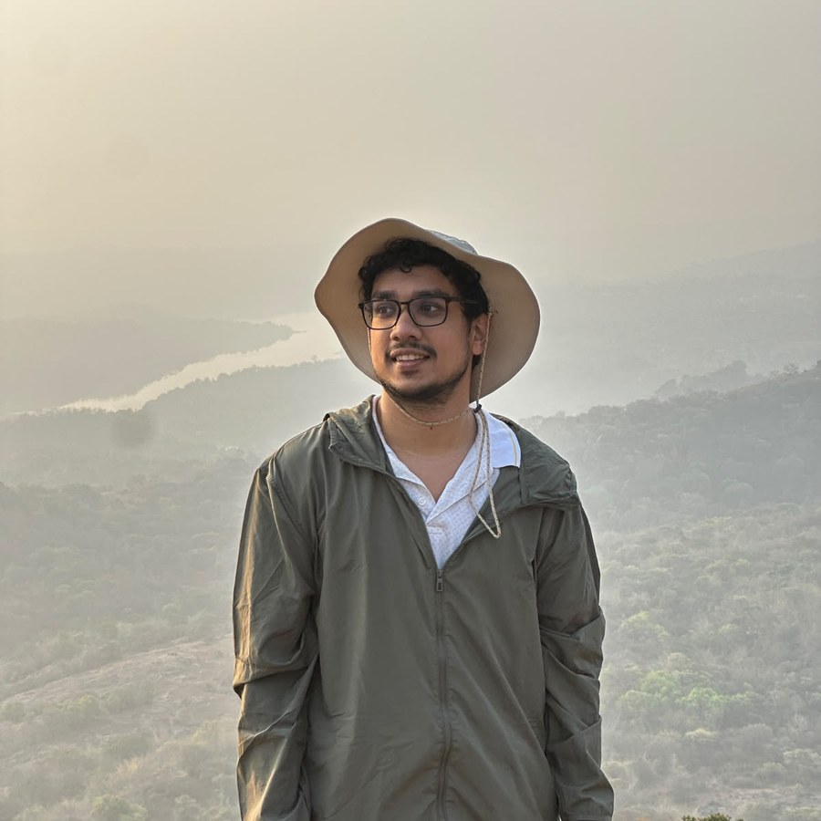 Arjun Bindu Jayachandran on a hilltop at sunrise